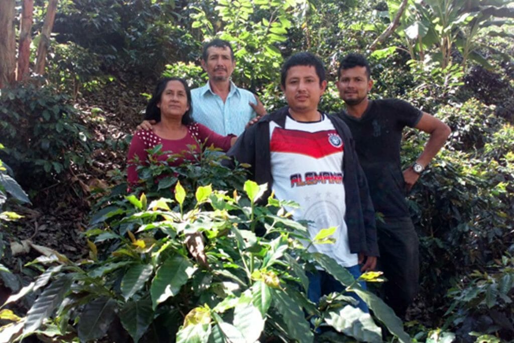 Specialty coffee producer and her family on their specialty coffee farm in Peru