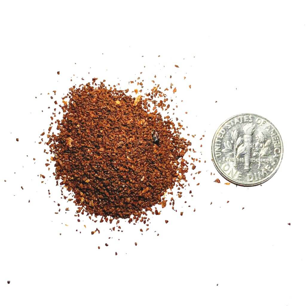 coffee grind size compared next to a dime