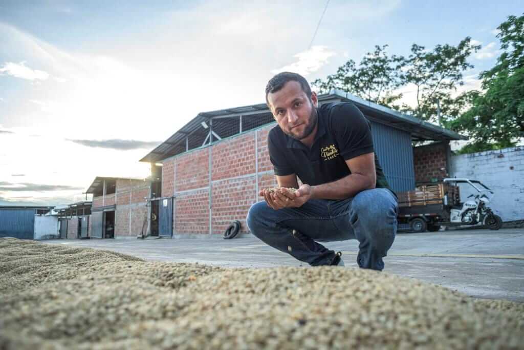 Julian at a coffee drying patio in Huila